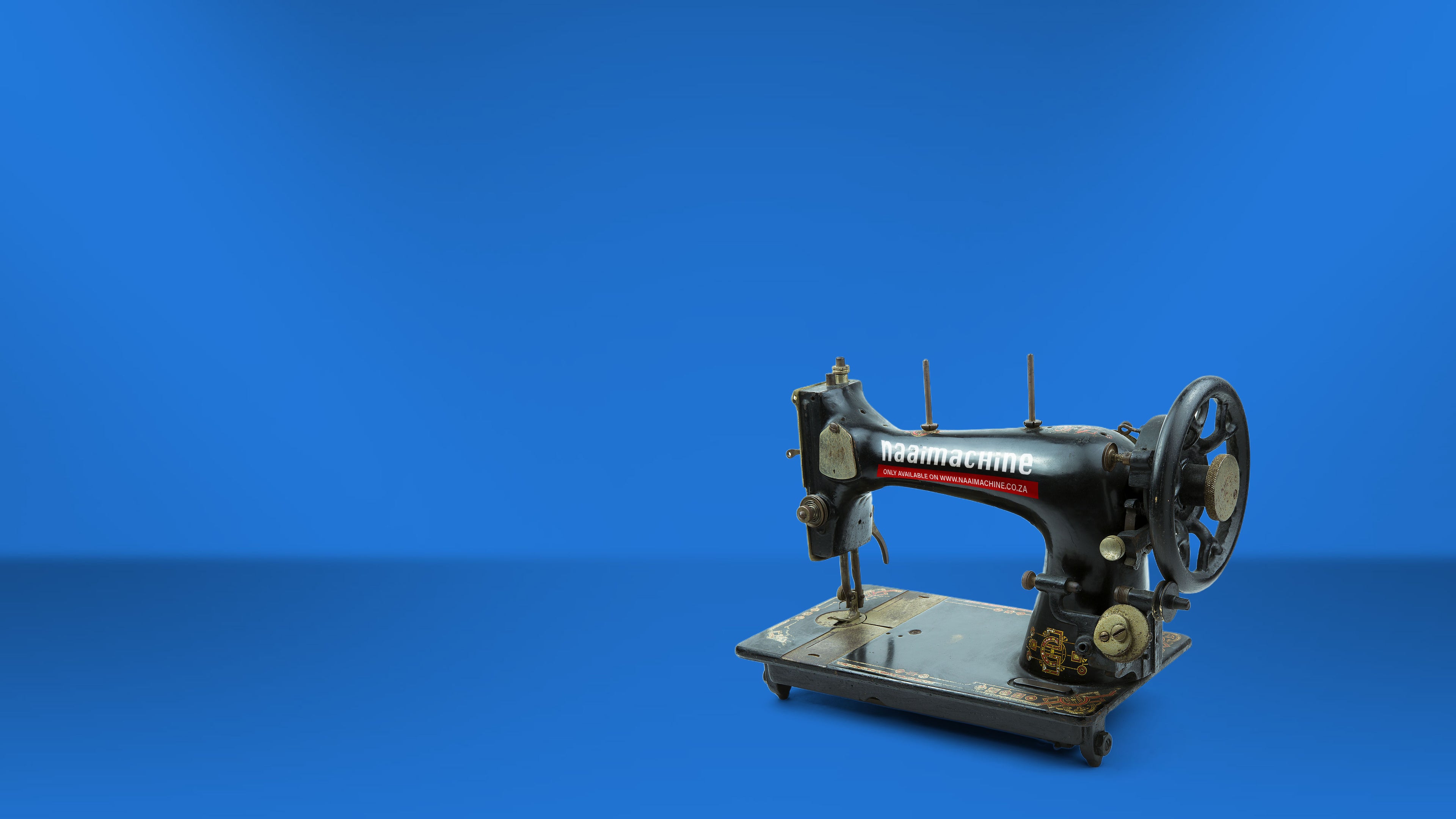 Vintage sewing machine on a blue background
